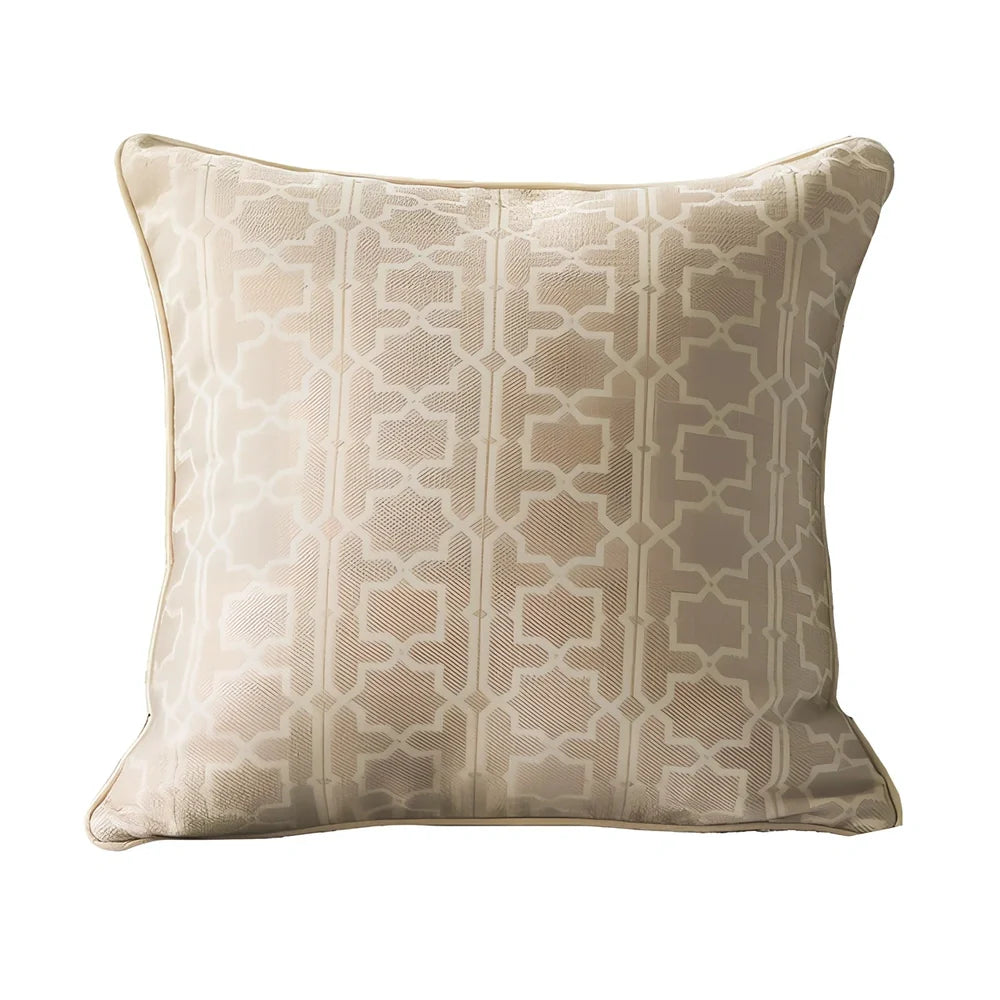 Square beige cushion cover with envelope closure on a grey sofa