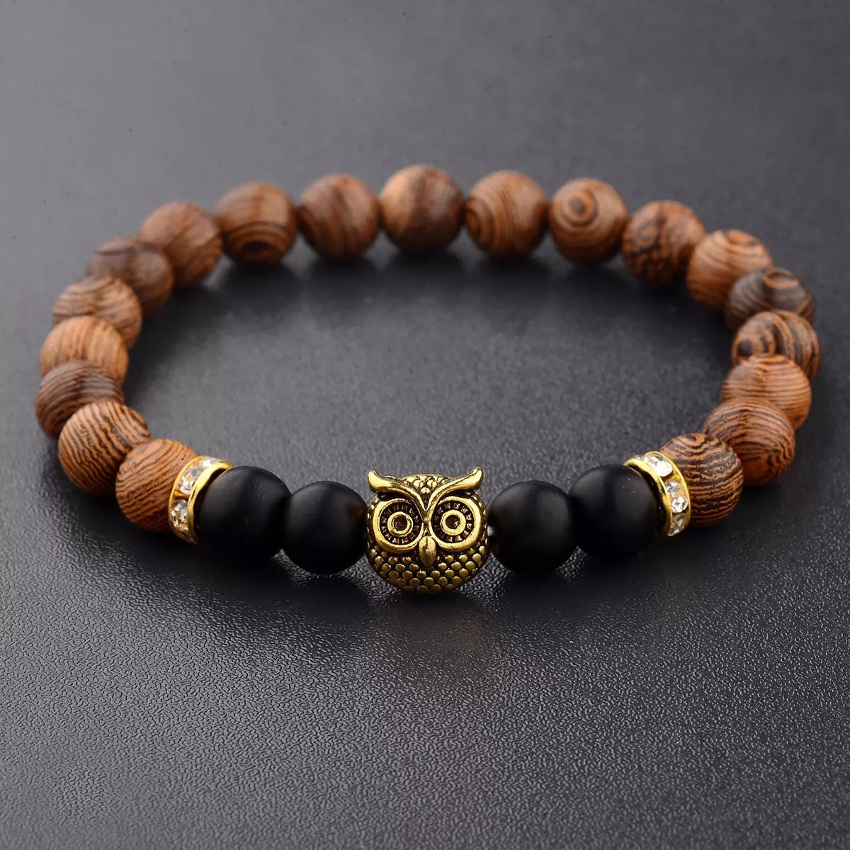 Owl frosted stone lifeline wood grain bracelet in black and gold, featuring wood beads and alloy stone