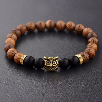 Owl frosted stone lifeline wood grain bracelet in black and gold, featuring wood beads and alloy stone