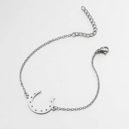 Punk Horse Shoe Chain Bracelet in gold and steel colors, featuring a unique U-shape charm