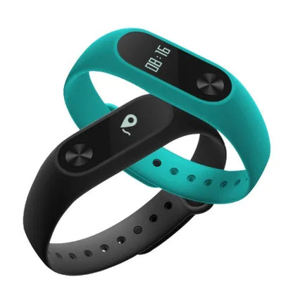 Xiaomi Mi Band 2 black fitness tracker with OLED display showing heart rate and time on adjustable wrist strap