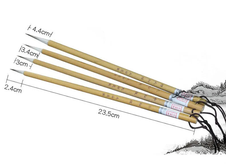 Four traditional Chinese calligraphy brushes with thin gold bodies and pine branch design