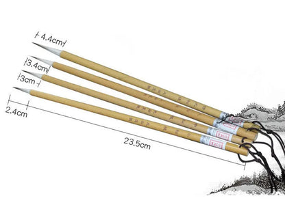 Four traditional Chinese calligraphy brushes with thin gold bodies and pine branch design