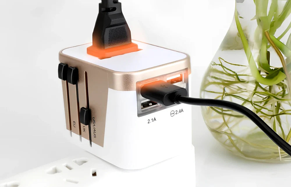 Black multi-country travel adapter 54x68x51mm with universal plugs for 2000W devices in 180 countries