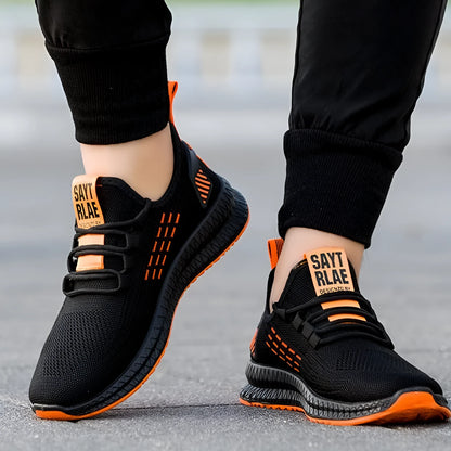 Men's black casual sports shoes with cross-strap detail on a Flying Weave upper and a flat, wear-resistant sole.