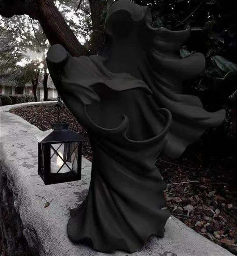 Faceless ghost sculpture in resin, a unique Halloween decoration with a spooky, supernatural design