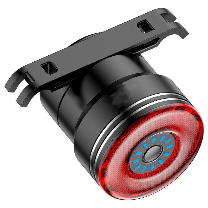 Black aluminium alloy bicycle taillight measuring 35x39x58mm with USB charging port and brake sensing technology