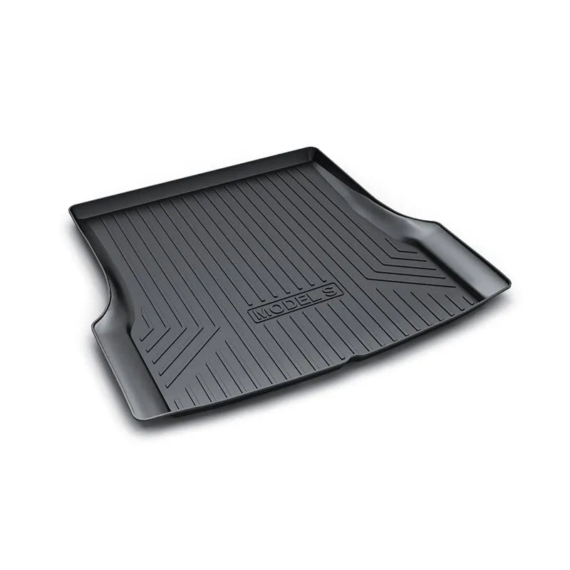 Black TPE rubber floor mats for Tesla Model 3, showing deep grooves and raised edges on driver's side.