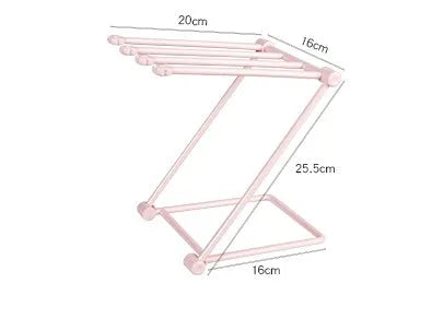 Foldable plastic dishcloth shelf organiser in Nordic style mounted on a kitchen wall