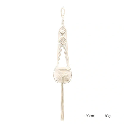 Hand-knitted cotton flowerpot net bag showing mesh pattern and hanging installation