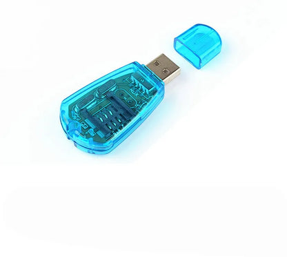 Blue USB SIM card reader for mobile phones placed next to a SIM card.