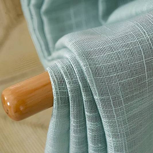 Linen curtains in cotton blend fabric showing half-shading function with light filtering through