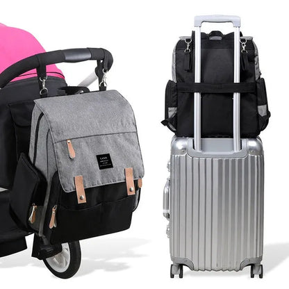 LAND Mommy large grey diaper backpack with changing mat, shown as a travel nappy bag.
