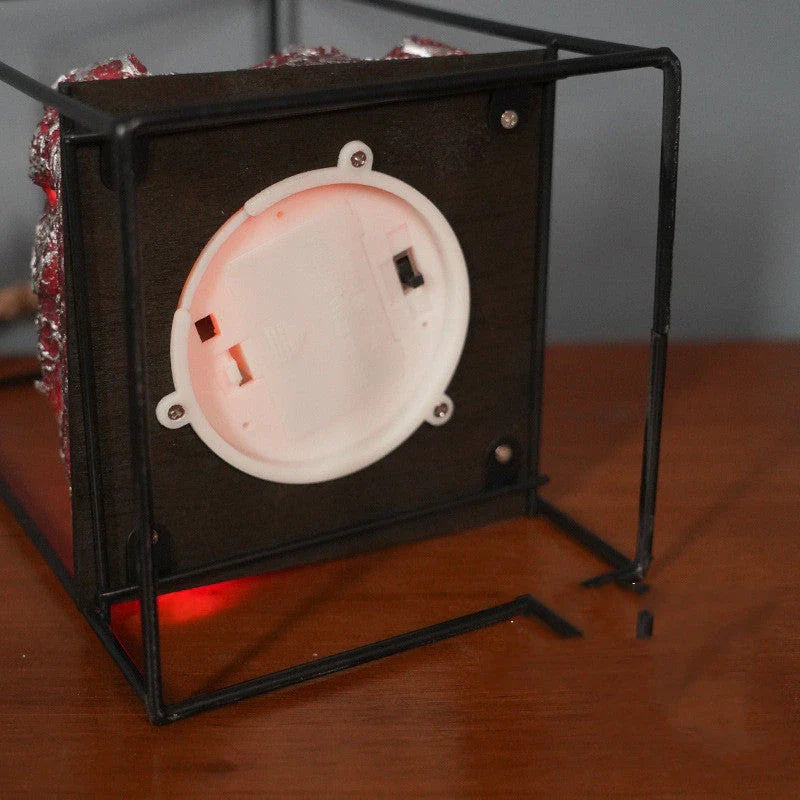 LED Flame Fireplace Lamp with simulated charcoal effect, creating a cozy and inviting ambiance in a living room.