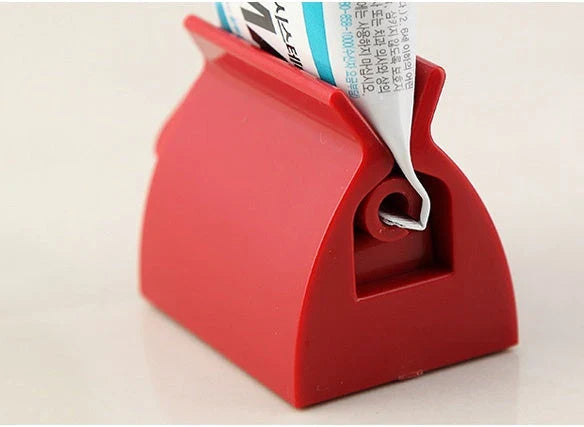 Versatile toothpaste dispenser made of durable ABS plastic for effortless product extrusion and bathroom organization