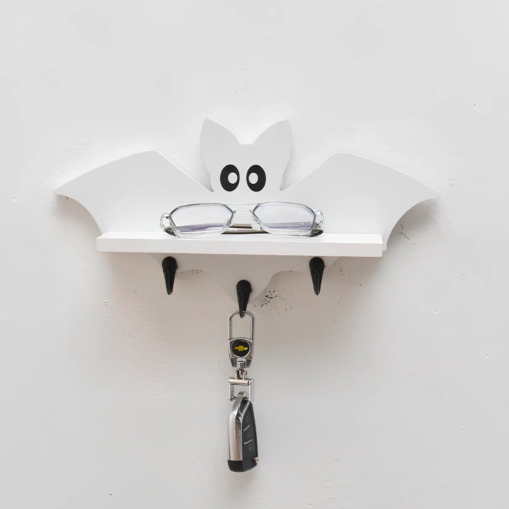 White pine animal-shaped wall shelf measuring 35cm wide by 17cm high on wall
