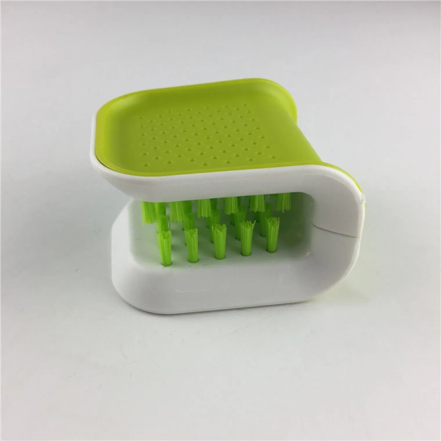 Blue U-shaped knife and cutlery cleaning brush with bristles for kitchen utensil cleaning