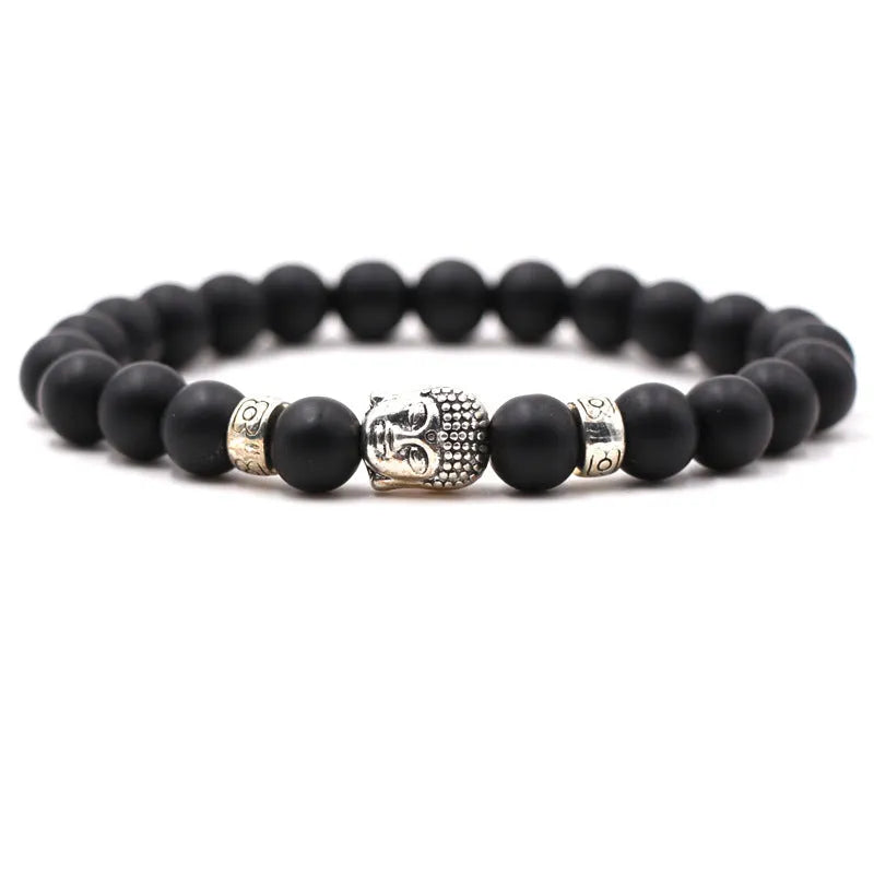 Natural stone stretch bracelet with round beads in various colours including Tigereye and turquoise.