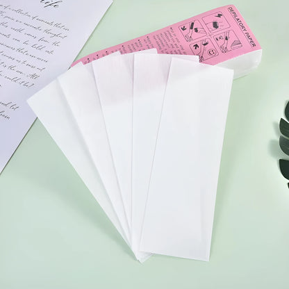 A pack of non-woven fabric hair removal wax paper auxiliary strips.