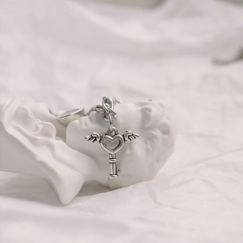 Stylish heart-shaped couple's bracelets with delicate floral accents made of durable iron chain