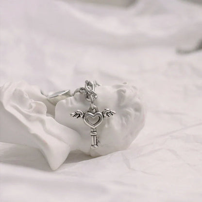 Stylish heart-shaped couple's bracelets with delicate floral accents made of durable iron chain