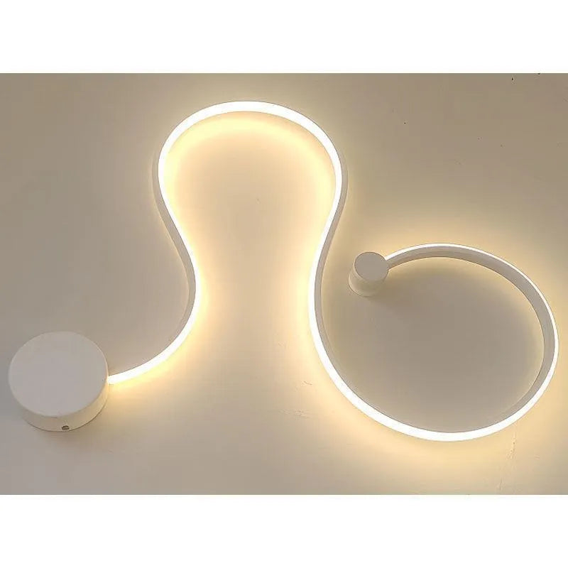 Modern black and white LED wall lamp with aluminium shade in four different sizes for bedside or corridor lighting