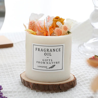 Aromatherapy candle with dried flowers on a wooden chip base, showing blue campanula and lavender scent options.