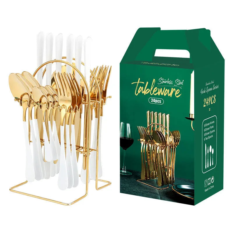 24-piece stainless steel cutlery set with knives, forks, spoons, and teaspoons on a storage rack in a gold finish.
