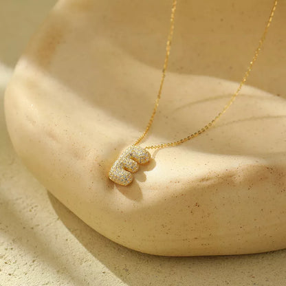 Stainless steel initial pendant necklace with zircon accents, personalized with your choice of letter.