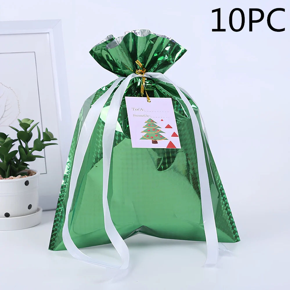 Christmas gift bag with drawstring closure in laser gold finish, 32x24cm dimensions