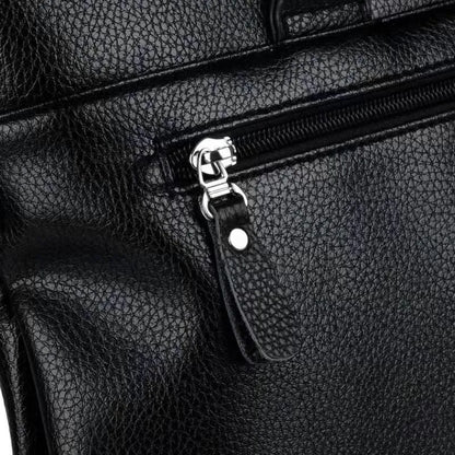 Men's black and brown PU leather shoulder messenger bag with splicing design, shown with crossbody strap.