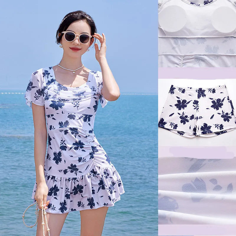 Women's white mesh swimming dress with short sleeves on mannequin