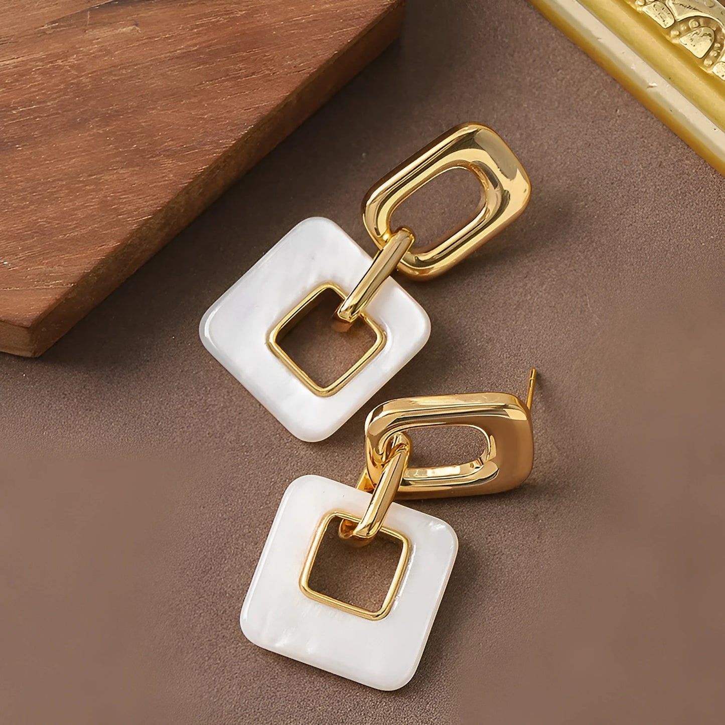 Hollow geometric square earrings with chamfered corners and electroplated copper finish