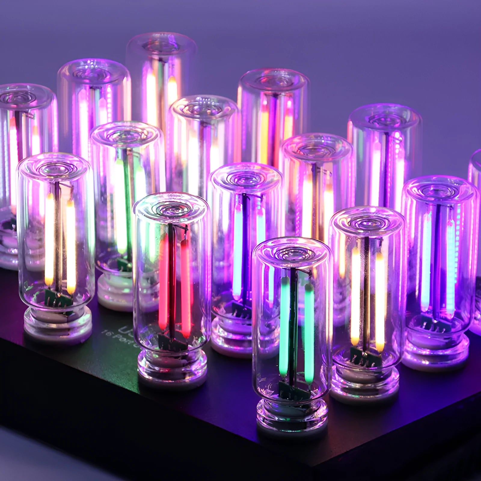 Small transparent glass USB touch night lamp with warm white light on a surface.