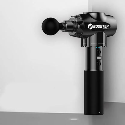 Black and white percussion muscle massager gun with ergonomic handle on a grey background.