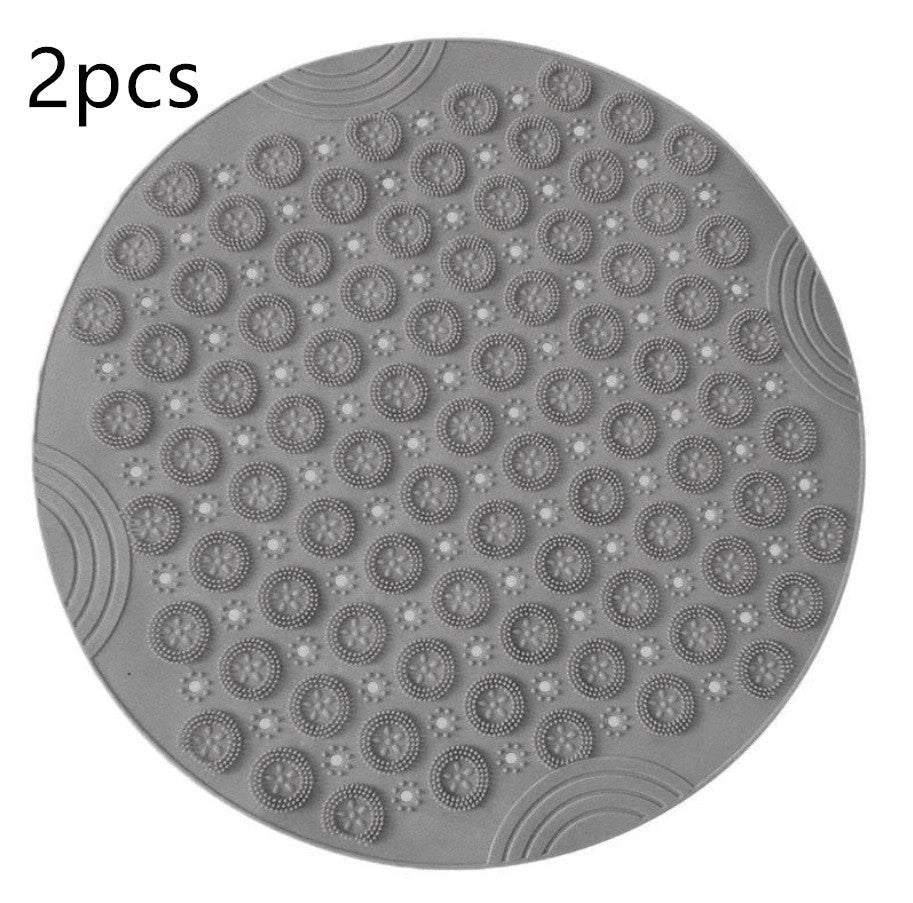 Textured round shower mat with anti-slip surface, massage nodules, and drainage holes for a comfortable and safe bathing experience
