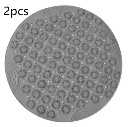 Textured round shower mat with anti-slip surface, massage nodules, and drainage holes for a comfortable and safe bathing experience
