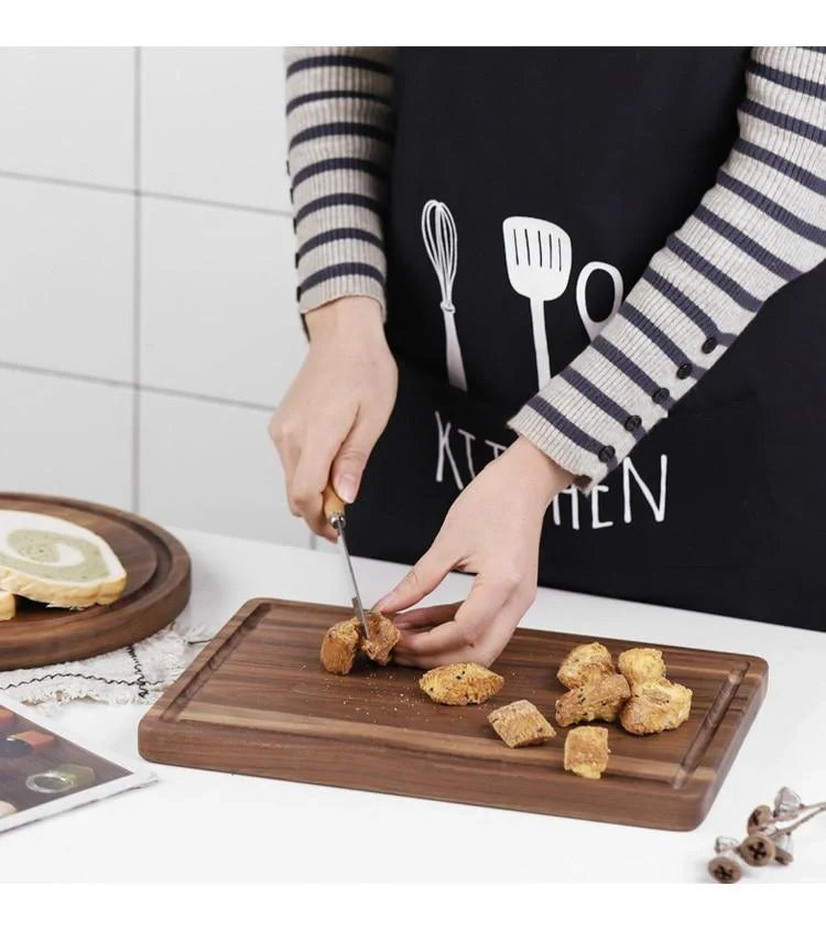 Premium black walnut wood cutting board with a versatile 2-sided design for chopping, slicing, and serving in the kitchen