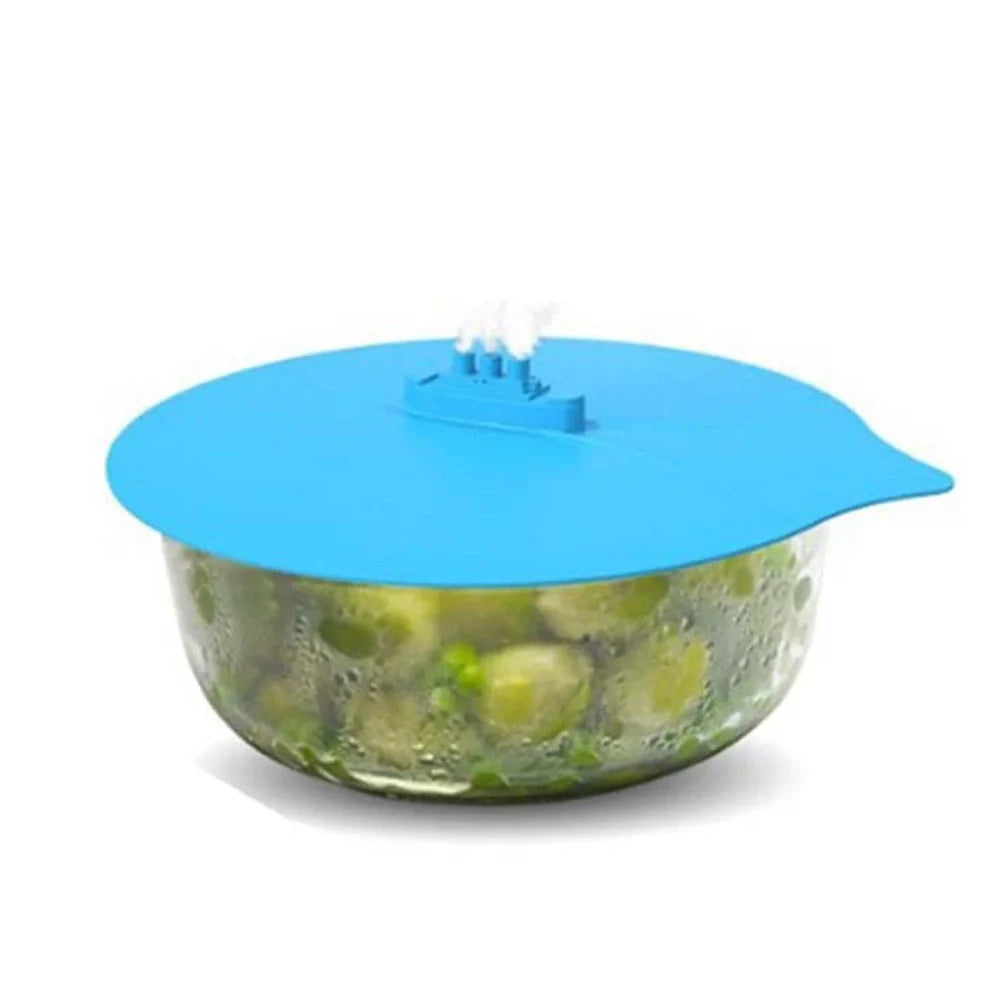 Blue silicone steamer lid measuring 26x25cm on kitchen bowl creating airtight seal for cooking