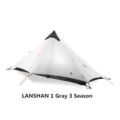 Single tip poleless tent with aluminium supports and camouflage design in outdoor setting