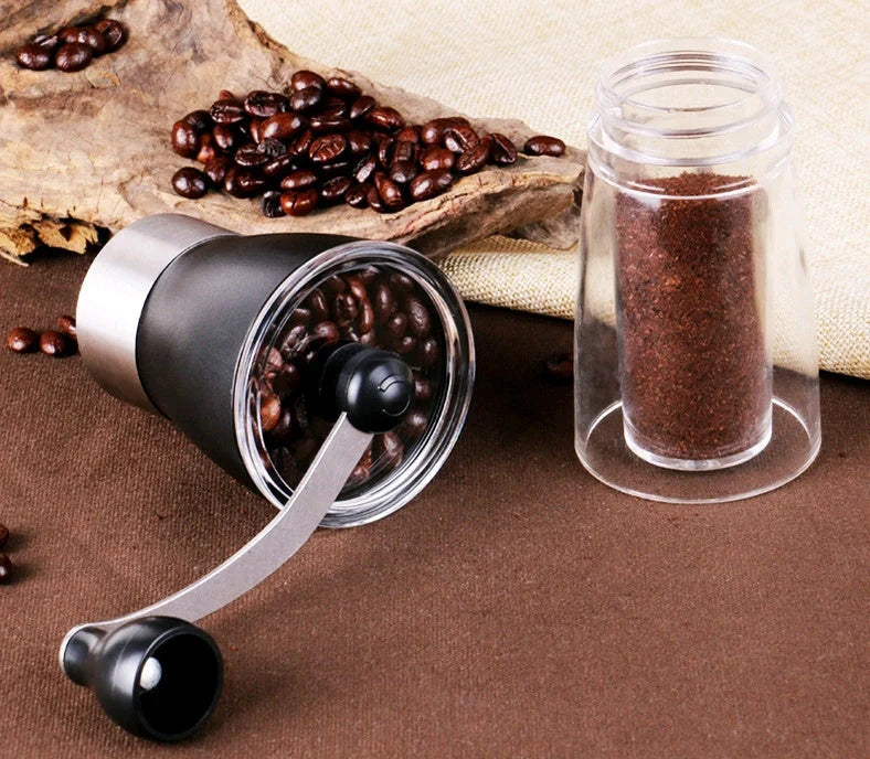 Compact manual coffee grinder with wooden body and stainless steel mechanism for fresh ground coffee at home