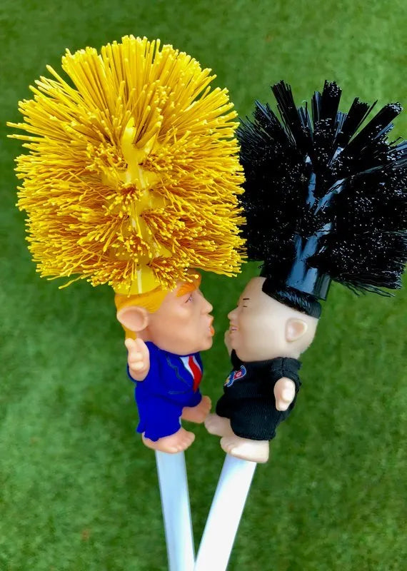 Yellow Donald Trump novelty toilet brush with hanging slot in handle