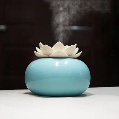 Lotus-shaped aromatherapy humidifier with ceramic base showing green and white colour option