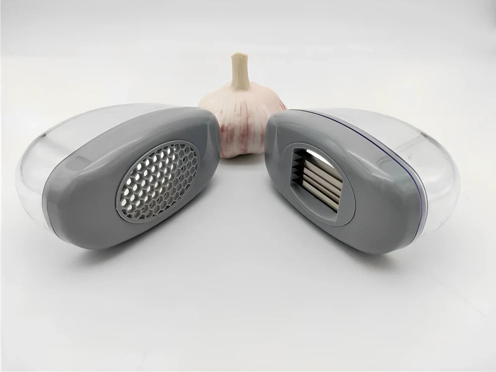 White plastic garlic cutter with stainless steel blades measuring 11cm long