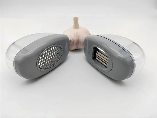 White plastic garlic cutter with stainless steel blades measuring 11cm long