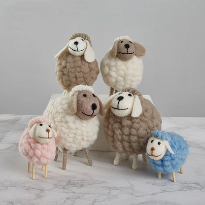 Adorable plush sheep decorations in various sizes and color combinations, perfect for adding a cozy, farmhouse-inspired touch to any home.