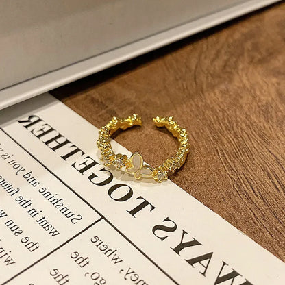 Copper women's ring with Chinese butterfly design and adjustable open loop.