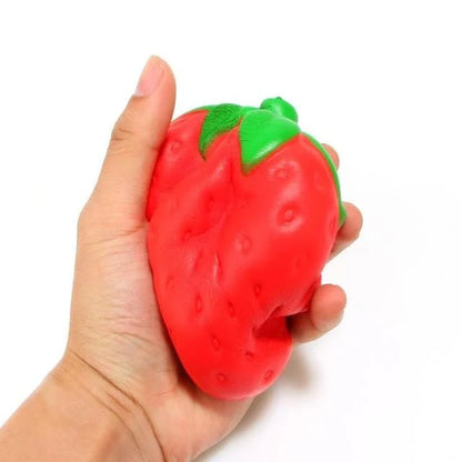 A squishy, strawberry-shaped stress relief ball made of durable polyurethane material