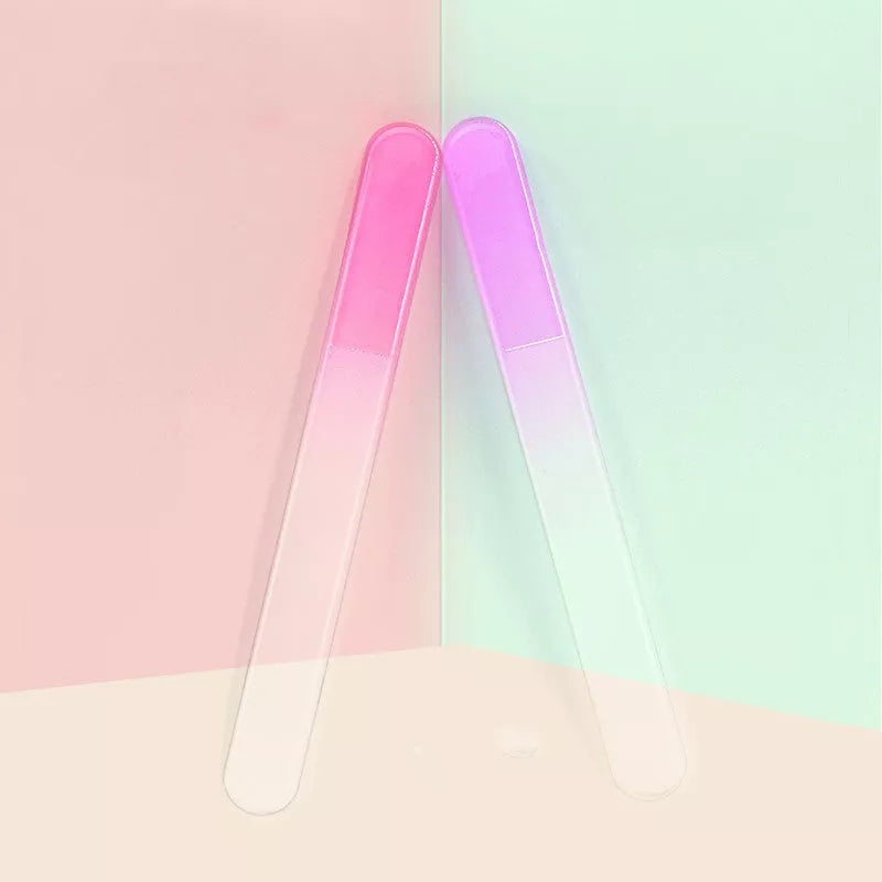 Five-piece child safety nail clippers with ergonomic grip in green, purple, and pink