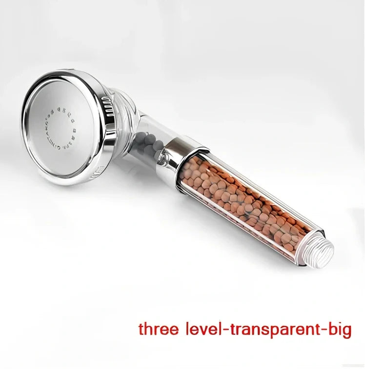 Pressurised shower head with stainless steel panel showing three water mode settings and removable nozzles